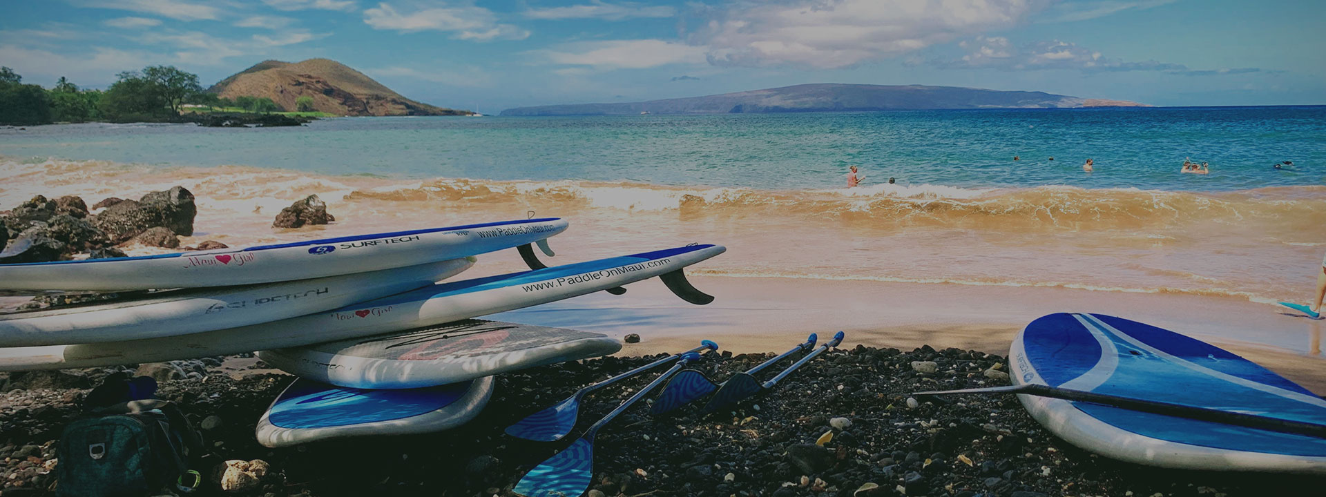 Surfboards laying on a beach